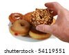 hand holding donut